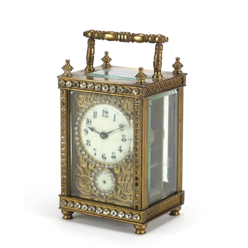 816 - French brass cased jewelled carriage clock, with blind fret panel, the enamelled dials with Arabic n... 