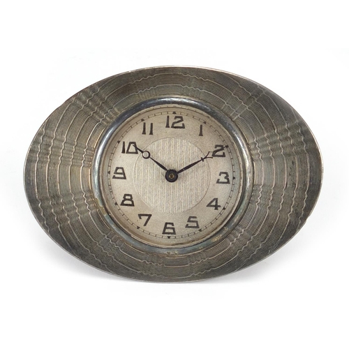 820 - Art Deco oval silver sun burst design strut clock, with Arabic numerals, Birmingham 1929, 9.5cm x 7c... 
