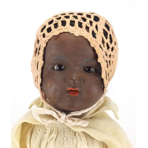 262 - Armand Marseille black bisque headed doll with composite limbs, numbered 99012, 58cm in length