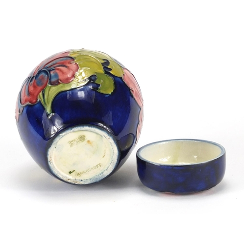 527 - Moorcroft pottery jar and cover, hand painted and tube lined in the anemone pattern, impressed marks... 