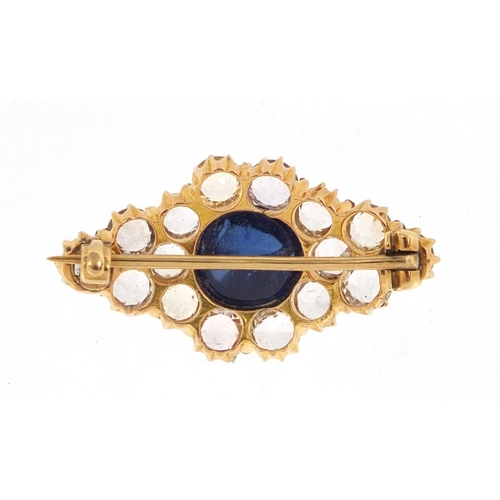 708 - Unmarked gold white sapphire cluster brooch set with a central cabochon blue sapphire, 2.8cm wide, a... 