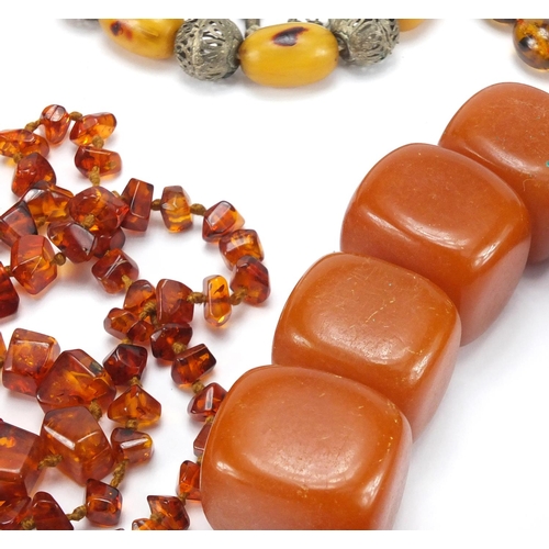 768 - Five amber coloured bead necklaces, approximate weight 670.0g