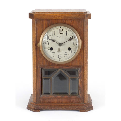 73 - Oak chiming mantel clock with Arabic numerals, 32cm high