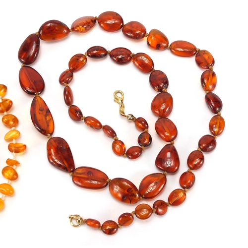 772 - Two amber coloured bead necklaces and a bracelet, the largest 90cm in length, approximate weight 49.... 