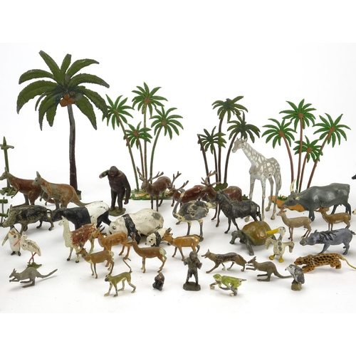 247 - Predominantly Britains hand painted lead zoo animals and cage posts including a cheetah and baboon, ... 