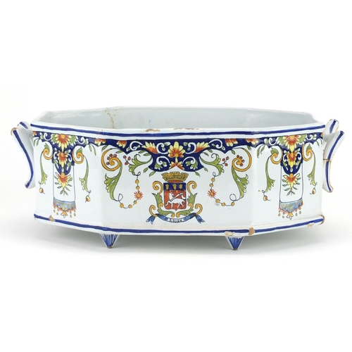 436 - French Quimper pottery octagonal planter with twin handles, hand painted with a crest and stylised f... 