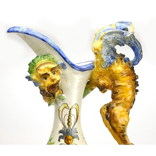 425 - Italian Majolica ewer in the style of Cantagalli, hand painted with putti and griffins, 66.5cm high