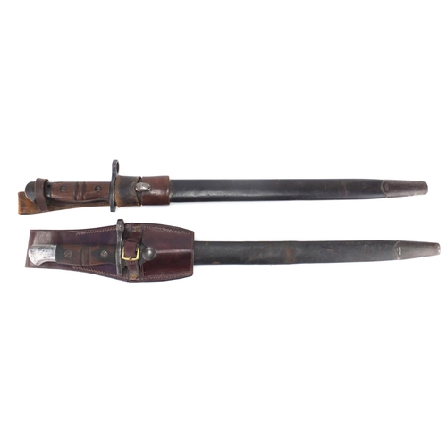 231 - Two American Military interest bayonets with scabbards and leather frogs, impressed marks to the bla... 