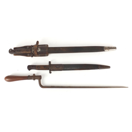 232 - Three Military interest bayonets including a 1905 pattern example, two with scabbards, one with leat... 