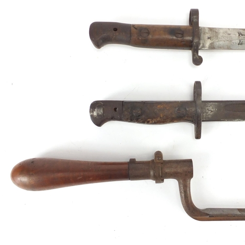 232 - Three Military interest bayonets including a 1905 pattern example, two with scabbards, one with leat... 