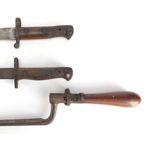 232 - Three Military interest bayonets including a 1905 pattern example, two with scabbards, one with leat... 