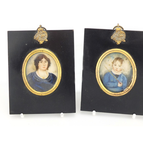 34 - Three 19th century oval hand painted portrait miniatures comprising a male, female and child, each m... 