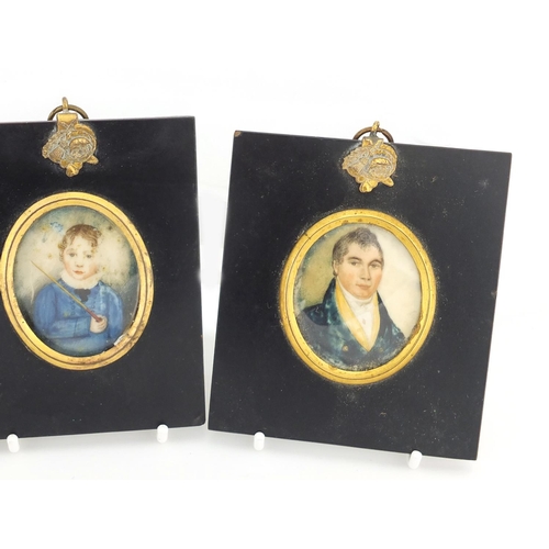 34 - Three 19th century oval hand painted portrait miniatures comprising a male, female and child, each m... 