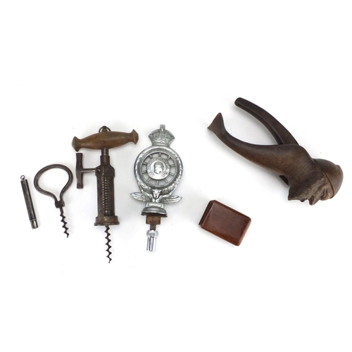 65 - Antique and later objects including a steel corkscrew, silver pencil holder, black forest nut cracke... 