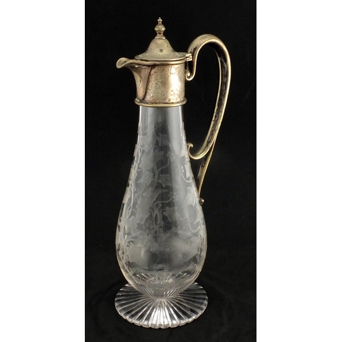 635 - Victorian glass claret jug with silver plated mounts, the body acid etched with a spider's web and v... 