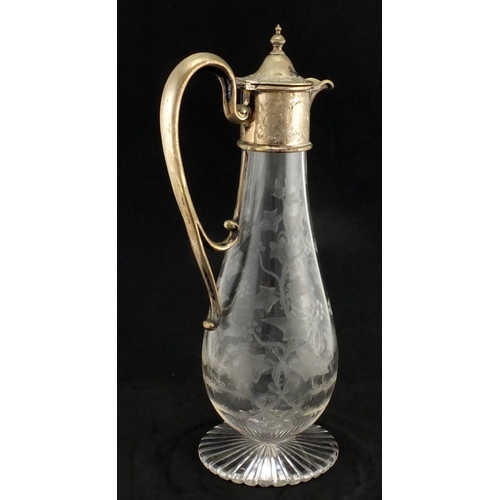 635 - Victorian glass claret jug with silver plated mounts, the body acid etched with a spider's web and v... 