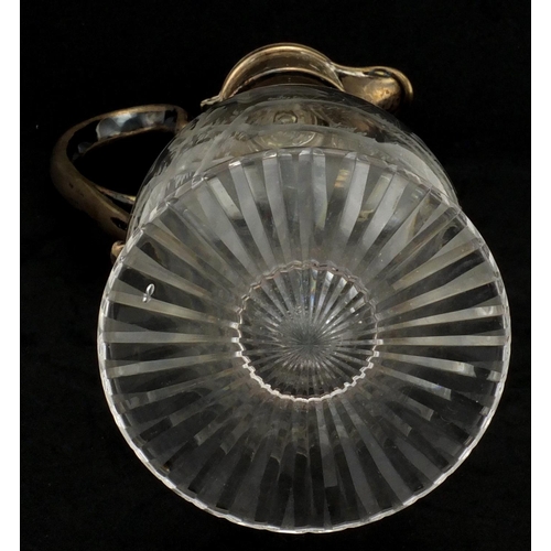 635 - Victorian glass claret jug with silver plated mounts, the body acid etched with a spider's web and v... 
