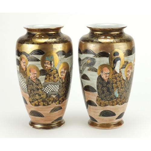 312 - Pair of Japanese Satsuma pottery vases, hand painted with sages and dragons, each 22cm high