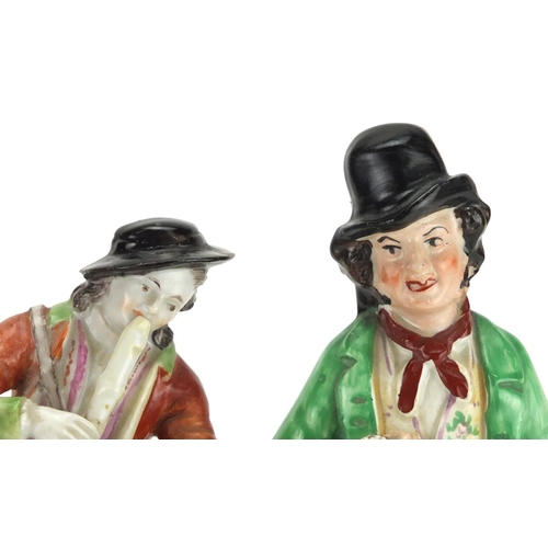 439 - Two 19th century figures including a Staffordshire gin and water example, the largest 22cm high