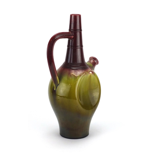 506 - Christopher Dresser design Linthorpe pottery ewer having a red and green dripping glaze, impressed 4... 