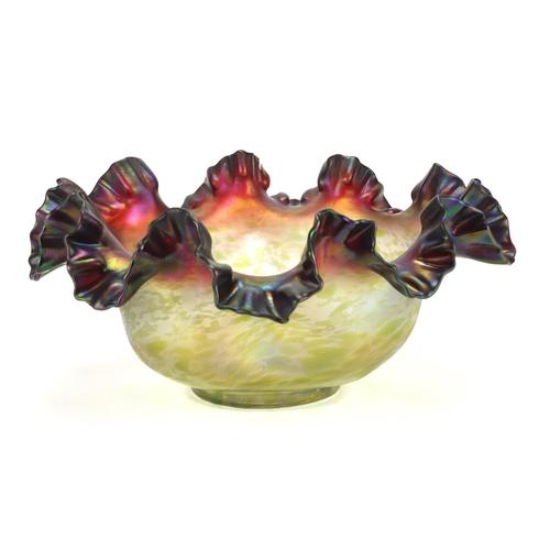 493 - Large purple iridescent glass bowl with frilled rim in the style of Loetz, 35cm in diameter