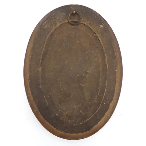 16 - Oval patinated bronze plaque cast with a mother and children, framed, 11.5cm x 7cm