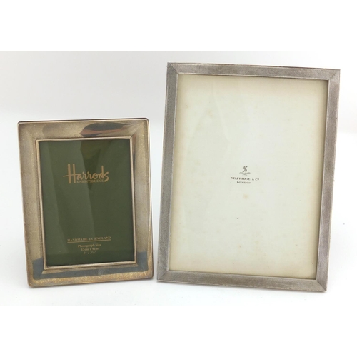 607 - Two rectangular silver easel photo frames, retailed by Selfridge & Co and Harrods, the largest with ... 