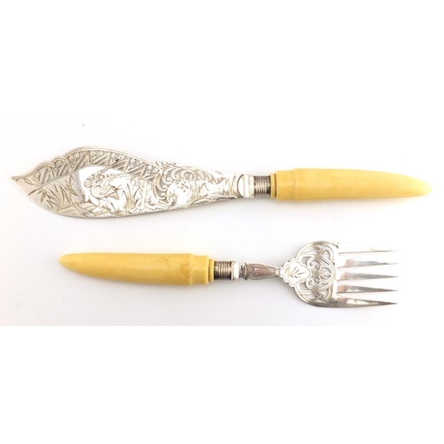 633 - Pair of Victorian fish servers with silver finials and ivory handles, the blade engraved with a hero... 