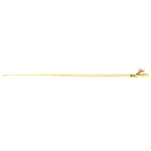 110 - Segmented ivory walking cane, the pommel carved in the form of an Egyptian bust, 90cm in length