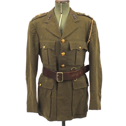 227 - British Military World War II uniform including tunics and a leather swagger stick