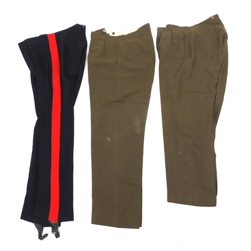 227 - British Military World War II uniform including tunics and a leather swagger stick