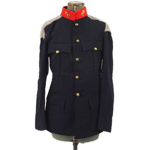 227 - British Military World War II uniform including tunics and a leather swagger stick