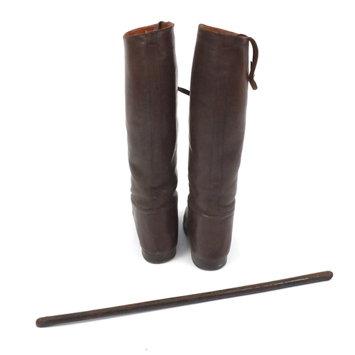 227 - British Military World War II uniform including tunics and a leather swagger stick