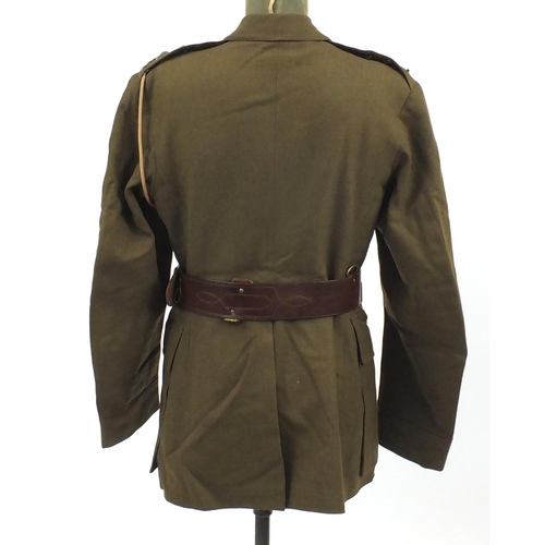 227 - British Military World War II uniform including tunics and a leather swagger stick