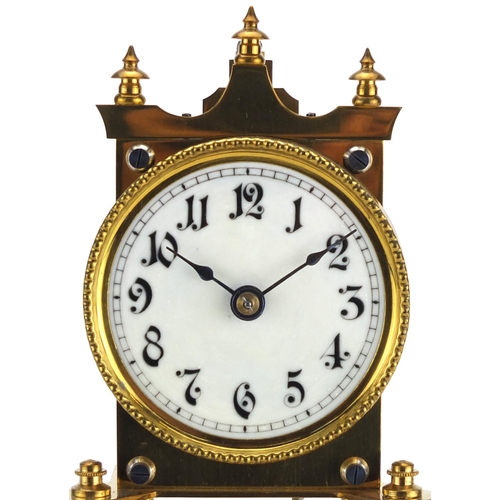812 - Urania Clock Company brass Anniversary clock, with enamelled dial and Arabic numerals, the movement ... 