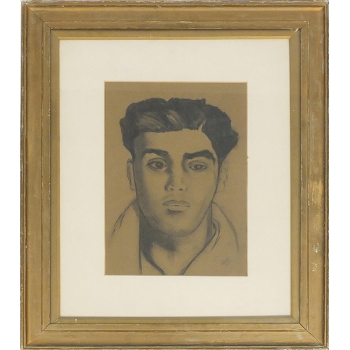 413 - Portrait of a young male, mixed media on paper, bearing a monogram possibly VOM, mounted and framed,... 