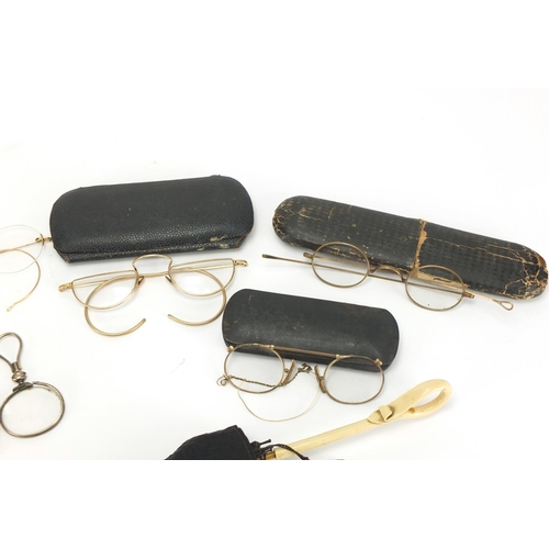 492 - Vintage gilt metal spectacles, some with cases and a miniature silk parasol with ivorine handle