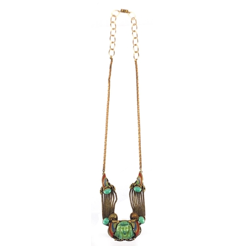 569 - ** DESCRIPTION AMENDED 1/3 ** 1930's Egyptian revival brass and painted pendant on necklace, 50cm in... 