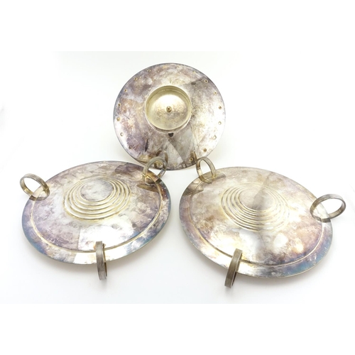 552 - Two Art Deco silver plated tripod dishes and a sectional cake stand, the largest 16cm high