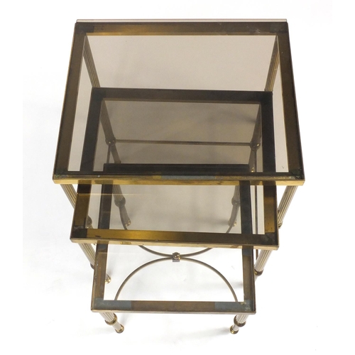 19 - Graduated nest of three brass coffee tables with glass tops, the largest 46cm H x 56cm W x 46cm D