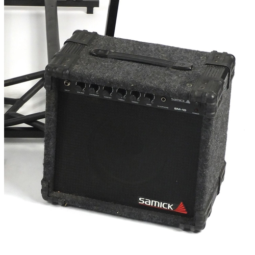 105 - Samick guitar amplifier, a Blues baseboard and guitar stands