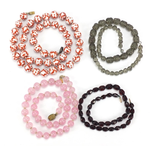 2855 - Four necklaces including Chinese porcelain beads and rose quartz