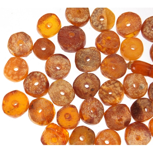 2838 - Loose amber coloured beads, approximate weight 44.0g