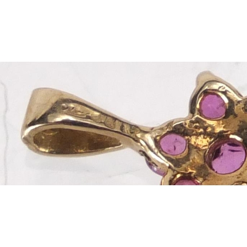 2832 - 9ct gold ruby flower head pendant, 1.2cm in length, approximate weight 0.5g