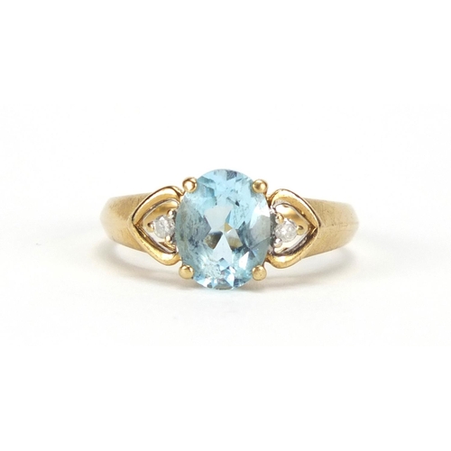 2664 - 9ct gold blue topaz and diamond ring, size N, approximate weight 2.7g