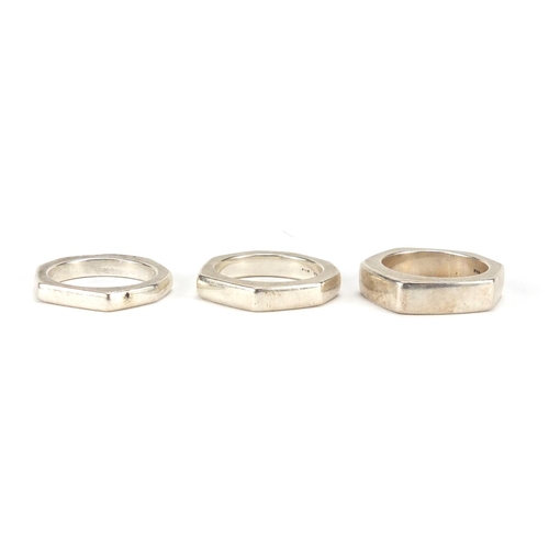 2840 - Graduated set of three Italian silver Gucci rings, each with registered numbers, sizes M-O, approxim... 