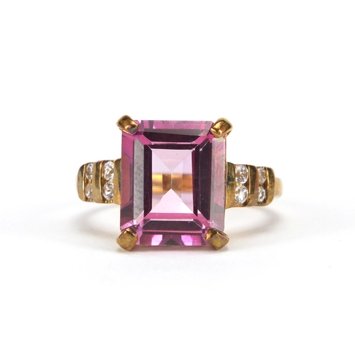 2806 - 9ct gold pink stone ring, set with clear stones to the shoulders, size N, approximate weight  5.0g