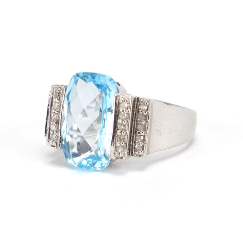 2673 - 14ct white gold blue stone ring set with diamonds to the shoulders, size S, approximate weight 7.9g