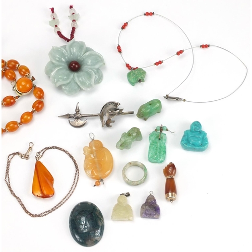 2830 - Polished stone jewellery and amber coloured bead necklaces including Buddha pendants, carved jade pe... 