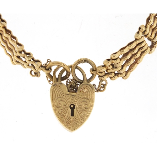 2643 - 9ct gold graduated five row gate bracelet with love heart shaped padlock, approximate weight 19.4g